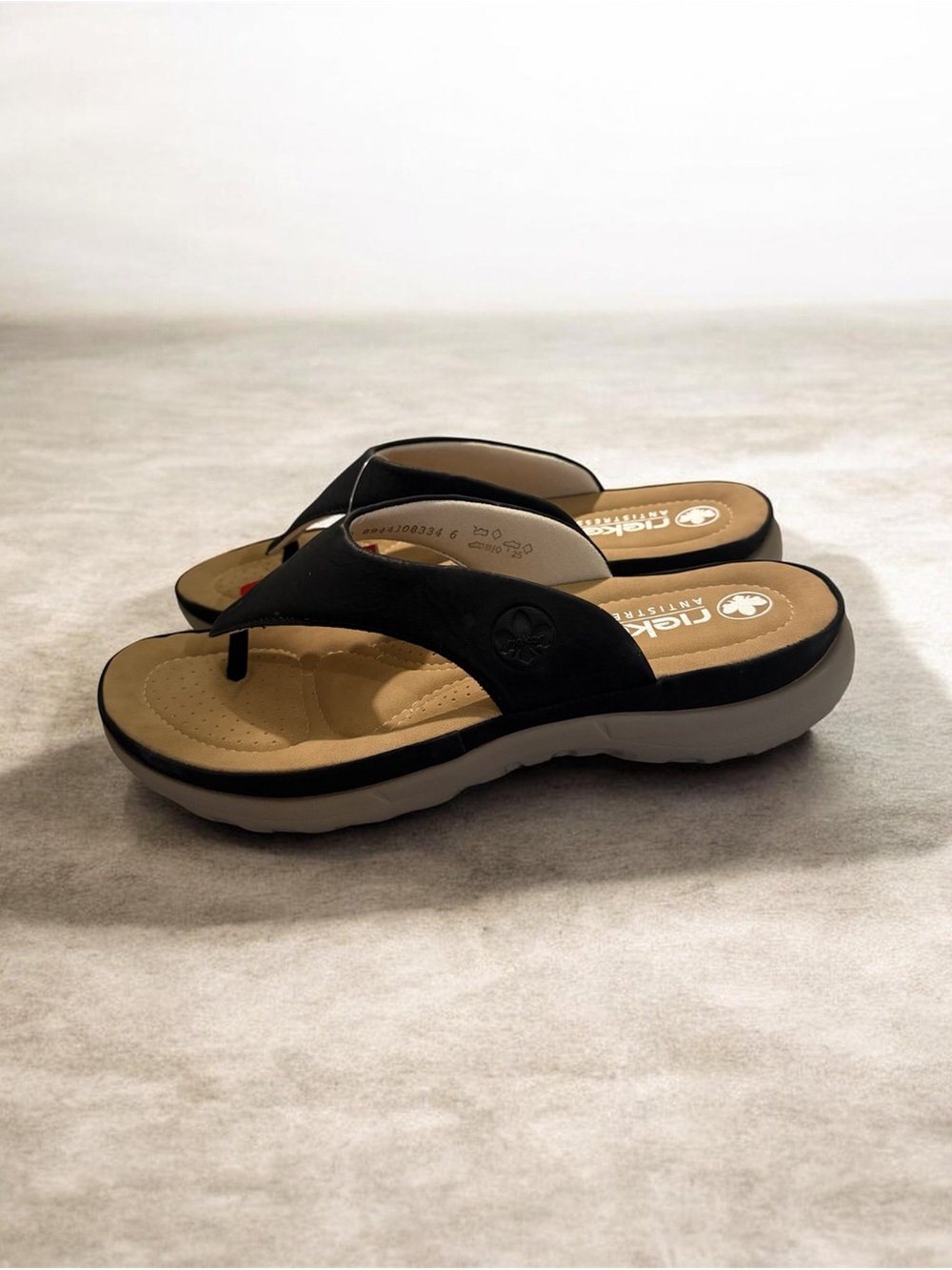 Rieker Black Thong Sandals with Beige Footbed